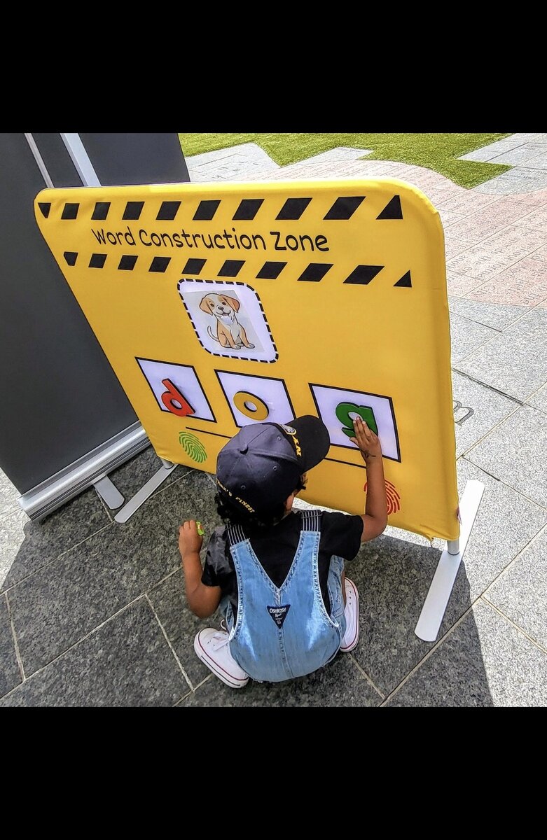 Child using Word Construction Zone interactive learning board