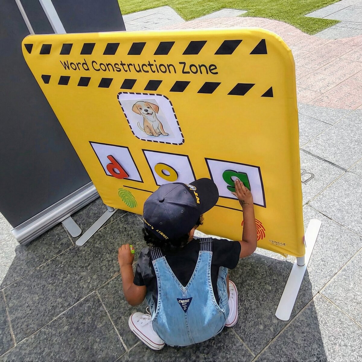 Child using Word Construction Zone interactive learning board